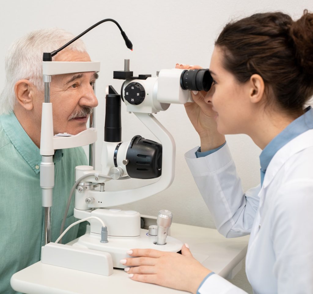 young-brunette-female-ophthalmologist-testing-eyesight-of-senior-male-patient.jpg